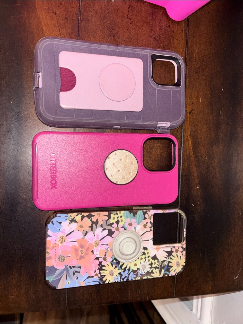 These are OtterBox phone cases and a phone case with a floral design